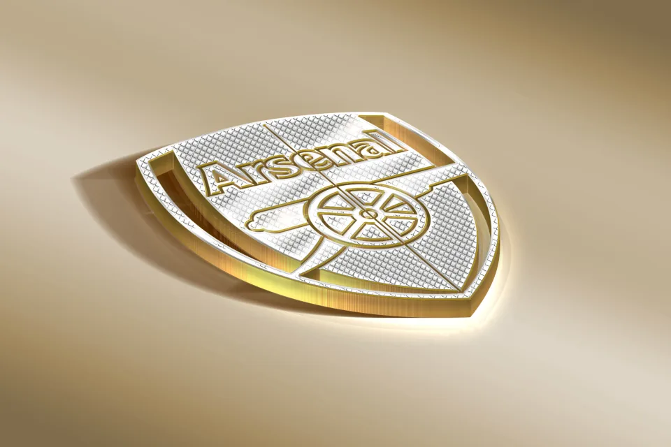 Logo Team Arsenal vor braunem Hintergrund